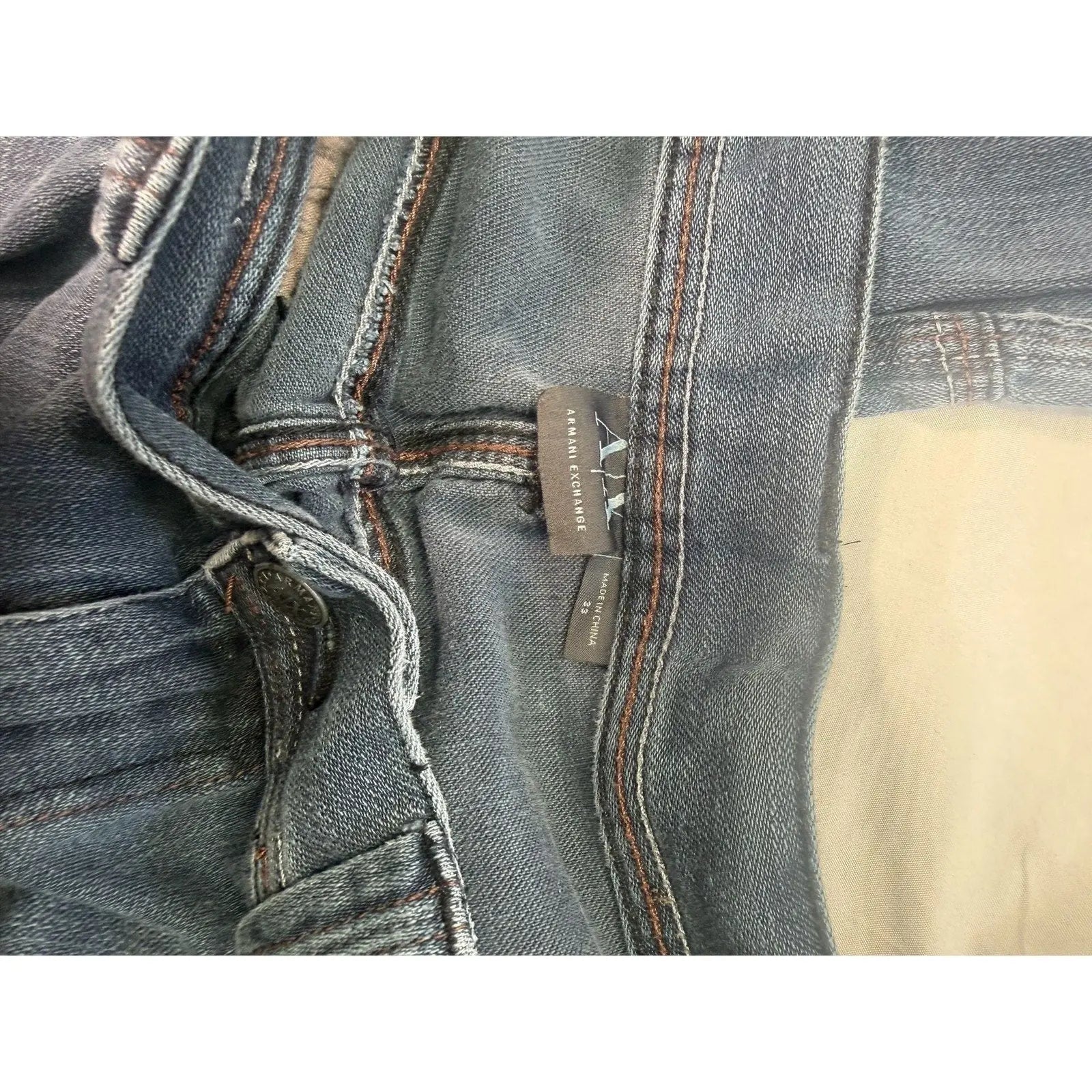 The Room Collective Armani Exchange Men's Dark Wash Biker Cargo Denim Jeans, size 33, with reinforced stitching and zipper accents.