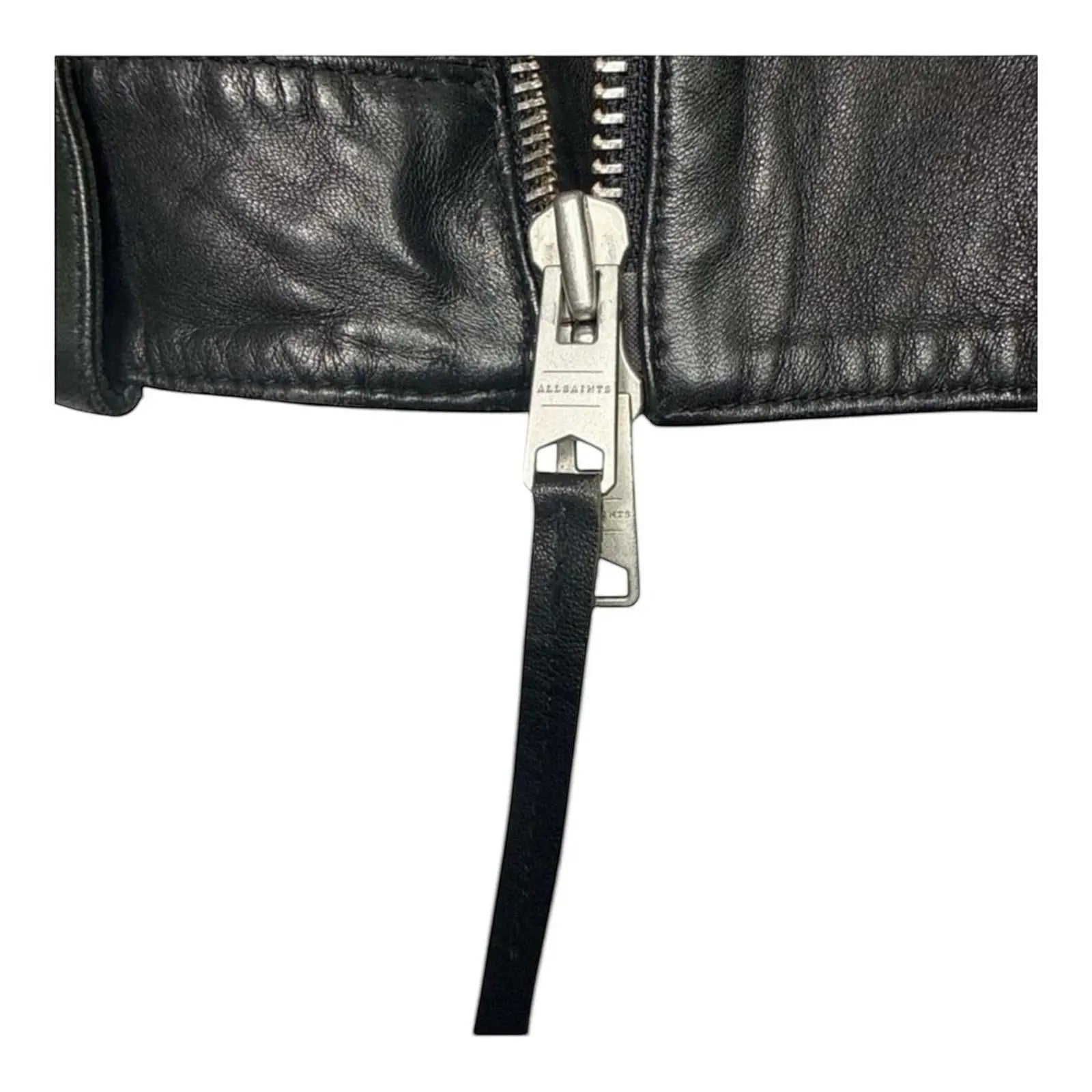 The Room Collective black leather biker jacket with asymmetric zip and AllSaints branding on zipper pull.