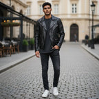 The Room Collective black leather biker jacket with quilted shoulders on a man wearing a grey t-shirt and black jeans.