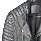 The Room Collective black leather biker jacket with quilted shoulders and asymmetric zip front.
