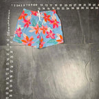 The Room Collective light blue swim trunks with pink and orange floral print, size small, elastic waistband, drawstring, and pockets.