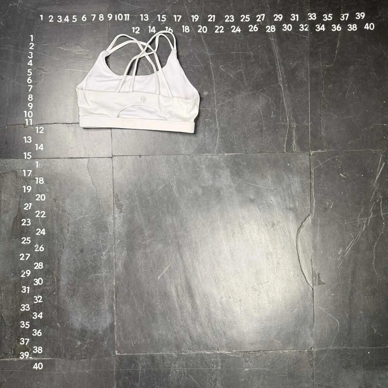 The Room Collective white Lululemon Free to Be Serene bra with strappy back detail, size M. Made from nylon and spandex blend.