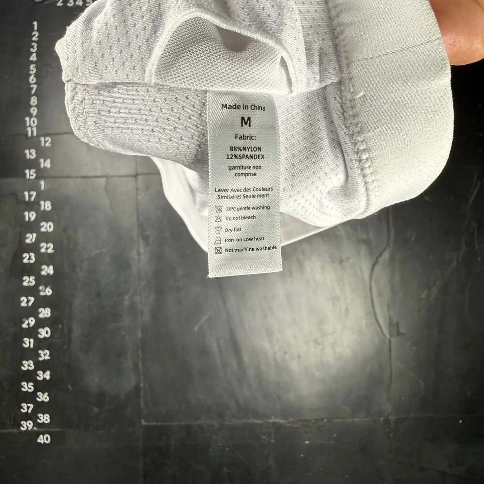 The Room Collective white Lululemon Free to Be Serene Bra, size M, with a strappy back detail and breathable mesh lining.