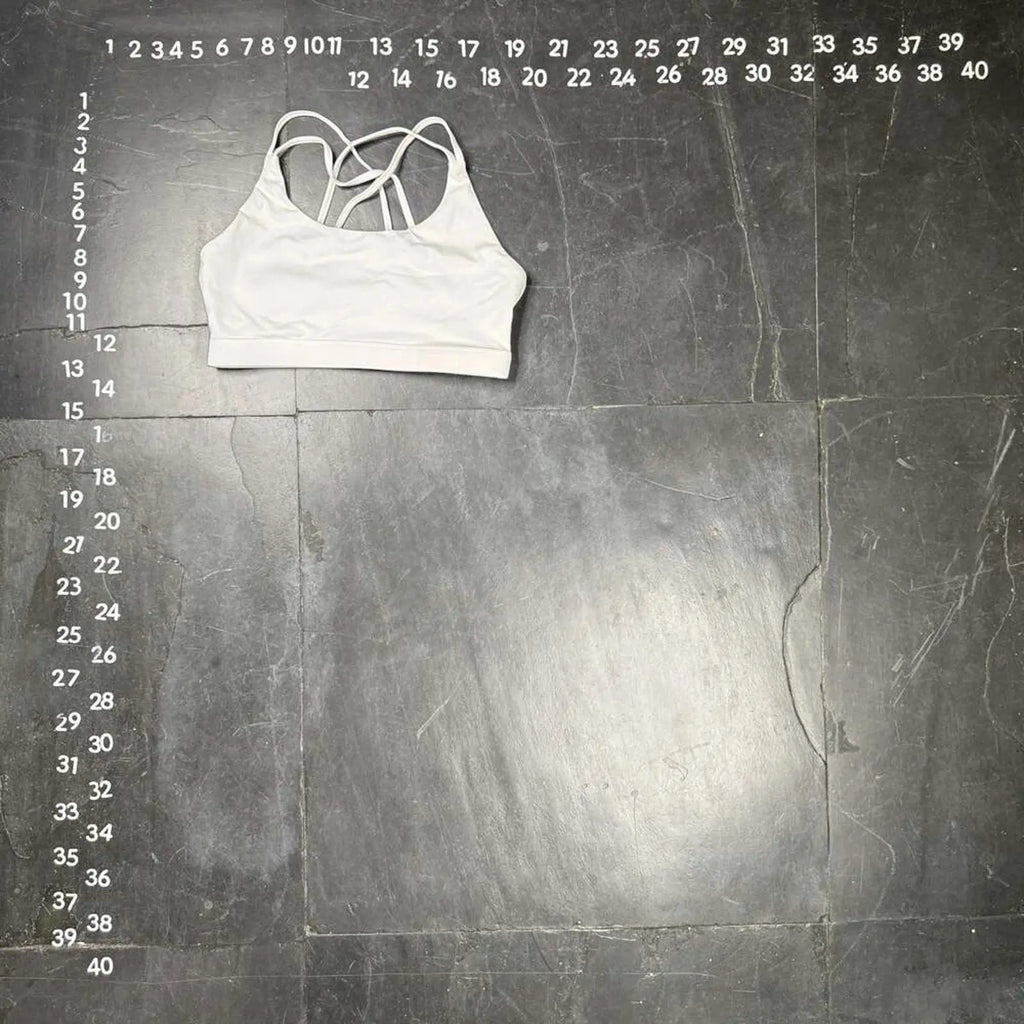 The Room Collective white Lululemon Free to Be Serene bra, size M, with strappy back detail. Ideal for yoga.