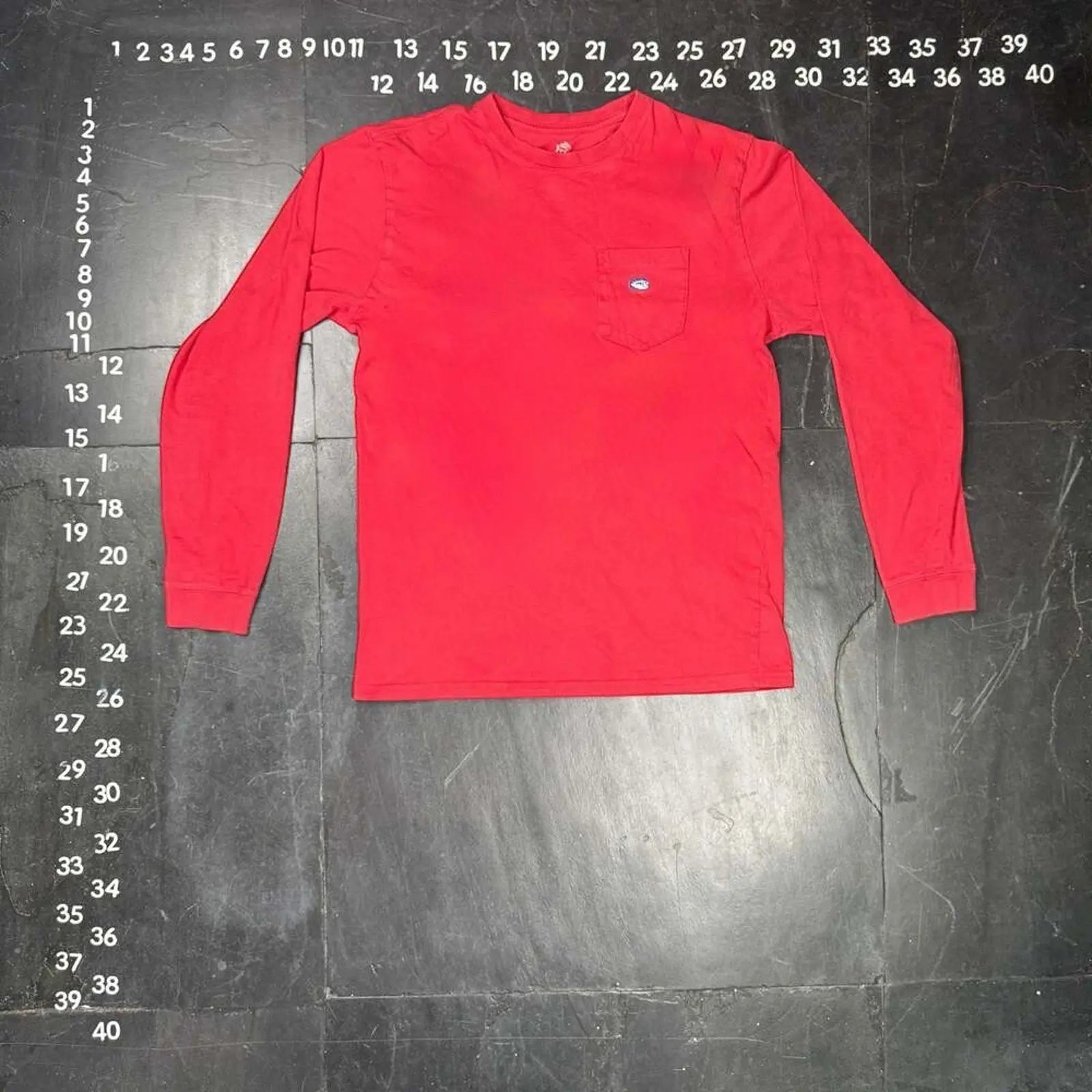 The Room Collective Men's red 100% cotton long sleeve pocket t-shirt, size Small, with skipjack logo detail.