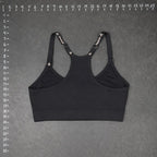 The Room Collective Reebok black logo strap sports bra, size S. Racerback design with adjustable straps.