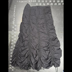 The Room Collective Riley black ruched nylon parachute skirt with adjustable drawstring hem and back zipper closure. Size S.