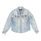 The Room Collective light wash denim trucker jacket with distressed cuffs and hem, featuring dual chest pockets and gold-tone buttons.
