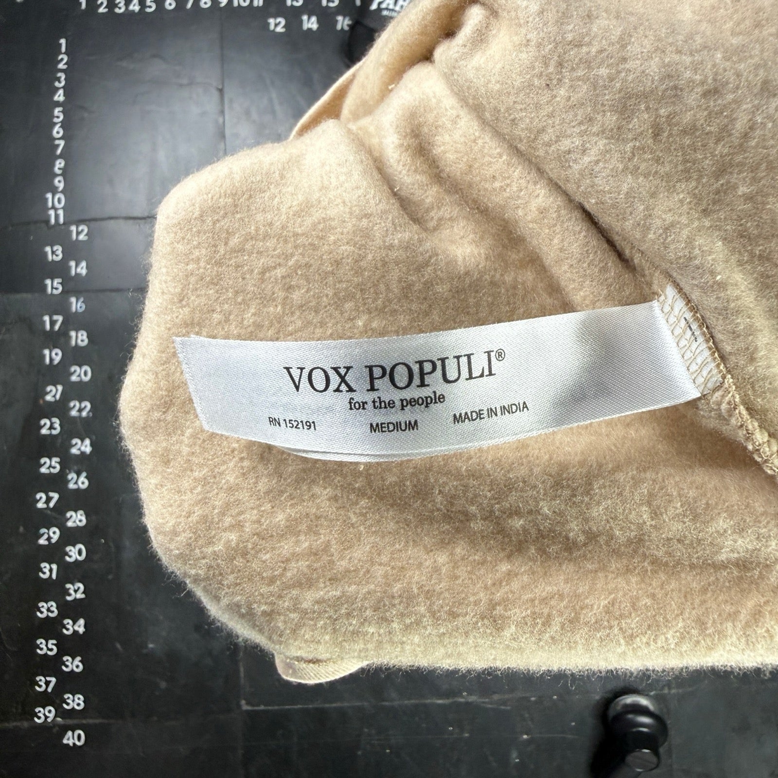 Curated apparel detail photographed for O.M.THRIFT